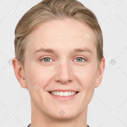 Joyful white young-adult female with short  brown hair and grey eyes