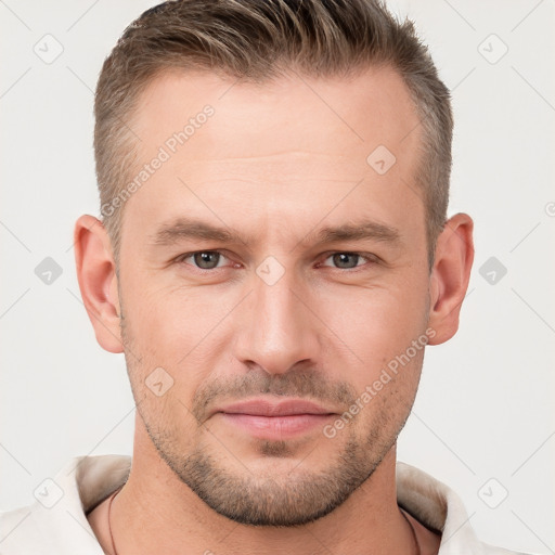 Joyful white young-adult male with short  brown hair and brown eyes