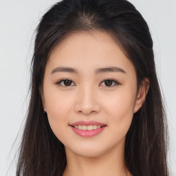 Joyful asian young-adult female with long  brown hair and brown eyes