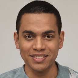 Joyful white young-adult male with short  black hair and brown eyes