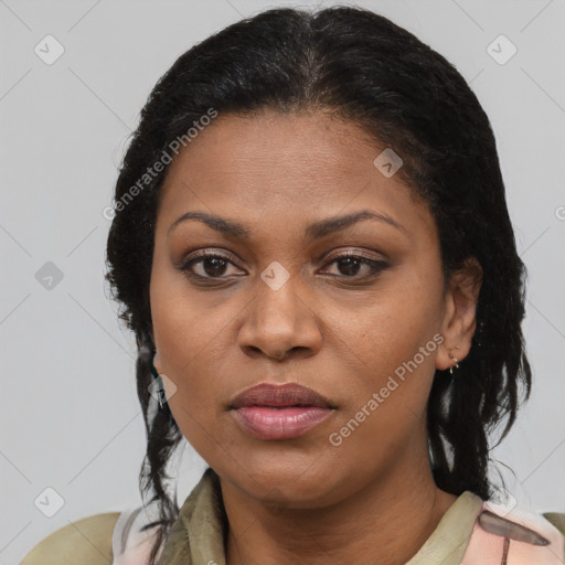 Joyful latino adult female with short  brown hair and brown eyes