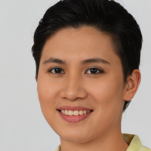 Joyful asian young-adult female with short  brown hair and brown eyes