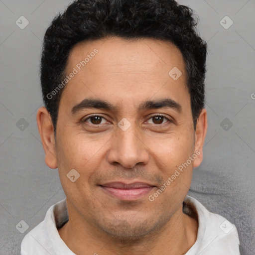 Joyful white adult male with short  black hair and brown eyes