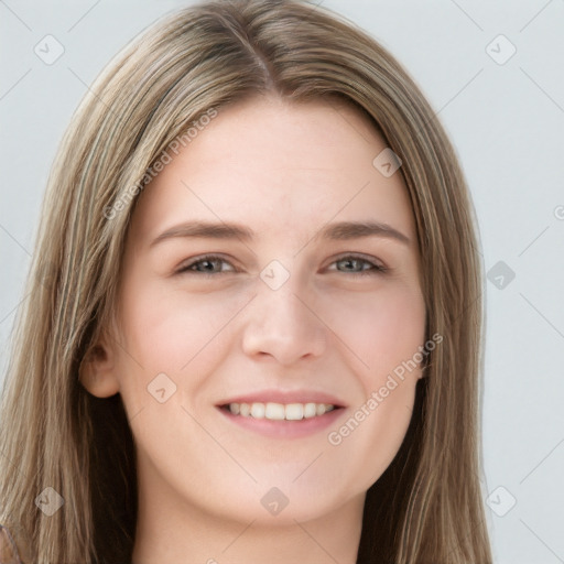 Joyful white young-adult female with long  brown hair and grey eyes