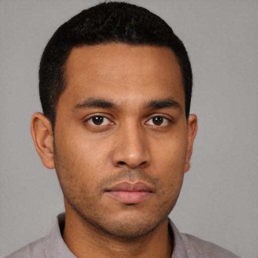 Neutral latino young-adult male with short  black hair and brown eyes