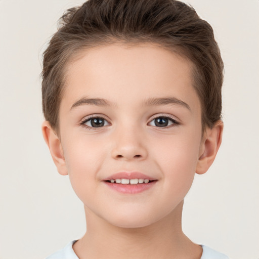 Joyful white child female with short  brown hair and brown eyes