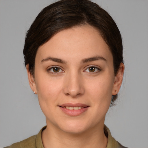 Joyful white young-adult female with medium  brown hair and brown eyes