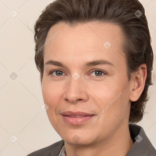 Joyful white adult female with medium  brown hair and brown eyes