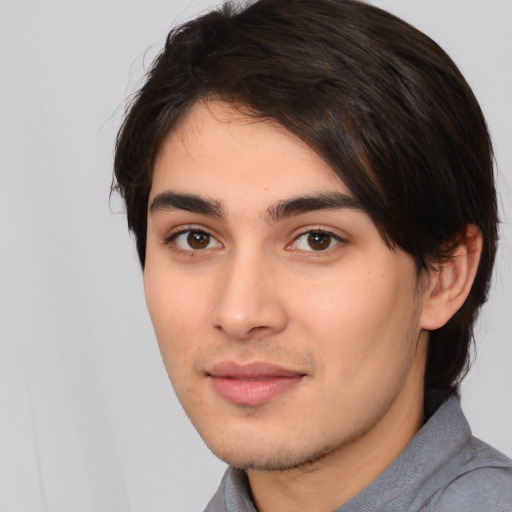 Joyful white young-adult male with medium  brown hair and brown eyes