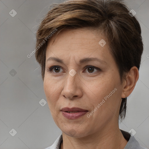 Joyful white adult female with medium  brown hair and brown eyes