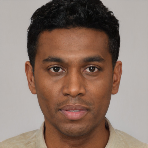 Neutral black young-adult male with short  black hair and brown eyes