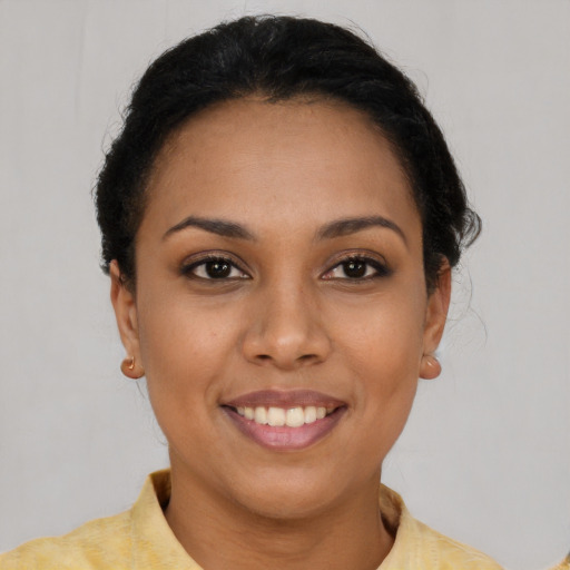 Joyful latino young-adult female with short  brown hair and brown eyes