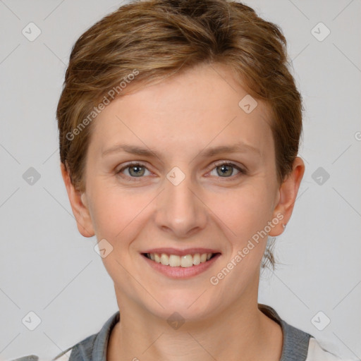 Joyful white young-adult female with short  brown hair and grey eyes