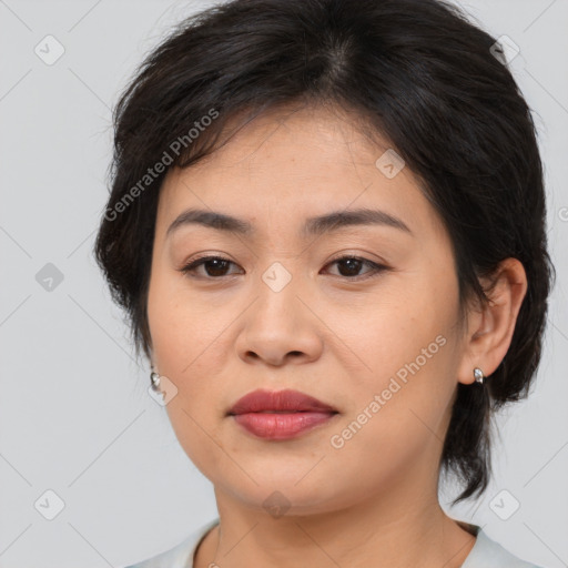 Joyful asian young-adult female with medium  brown hair and brown eyes