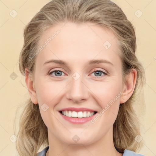 Joyful white young-adult female with medium  brown hair and blue eyes