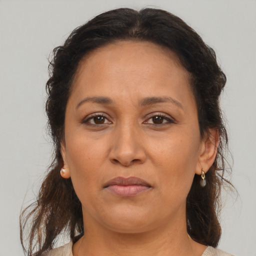 Neutral black adult female with medium  brown hair and brown eyes