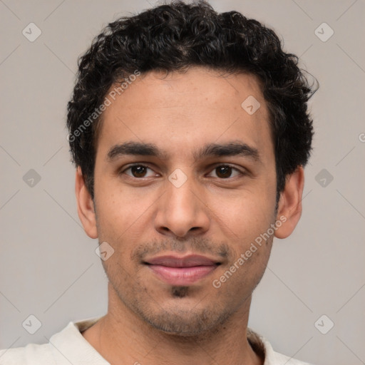 Joyful white young-adult male with short  black hair and brown eyes