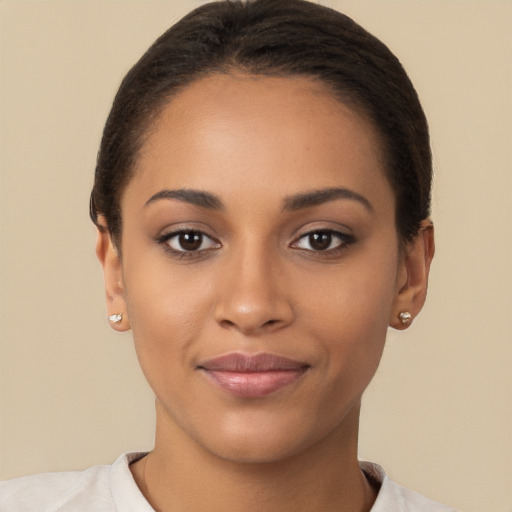 Joyful latino young-adult female with short  brown hair and brown eyes