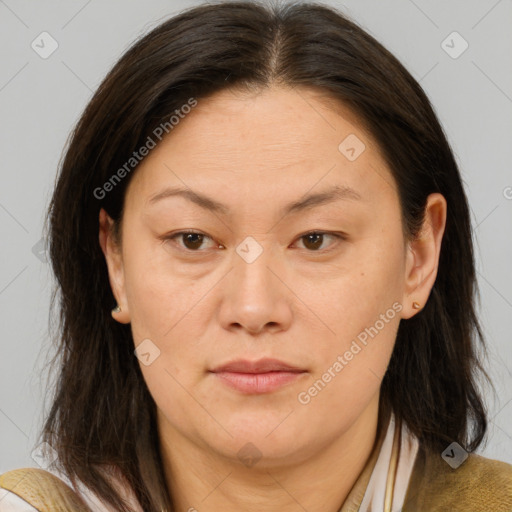 Joyful white adult female with medium  brown hair and brown eyes