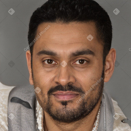 Joyful latino adult male with short  black hair and brown eyes