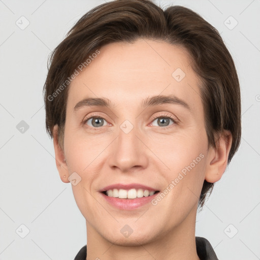 Joyful white young-adult female with short  brown hair and grey eyes