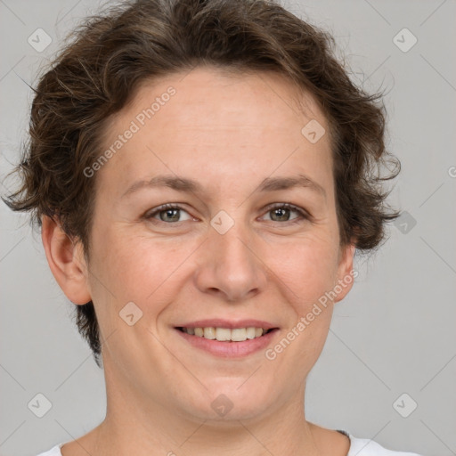 Joyful white adult female with short  brown hair and brown eyes