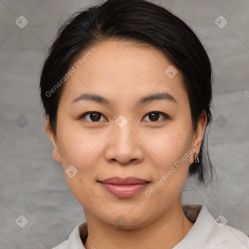 Joyful asian young-adult female with medium  brown hair and brown eyes