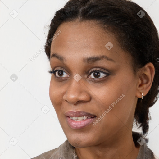 Joyful black young-adult female with medium  brown hair and brown eyes