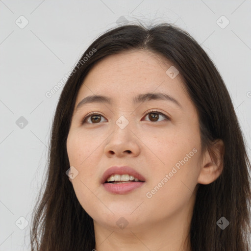 Joyful white young-adult female with long  brown hair and brown eyes