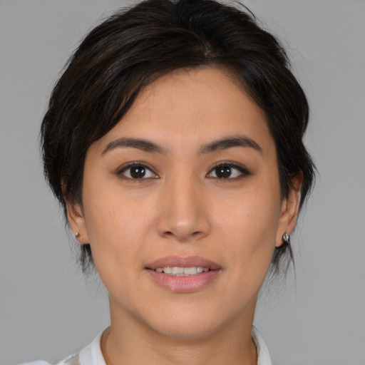 Joyful asian young-adult female with medium  brown hair and brown eyes