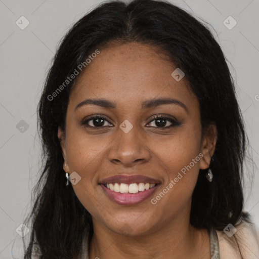 Joyful black young-adult female with long  brown hair and brown eyes