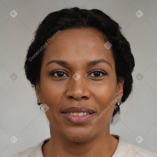 Joyful black adult female with short  black hair and brown eyes