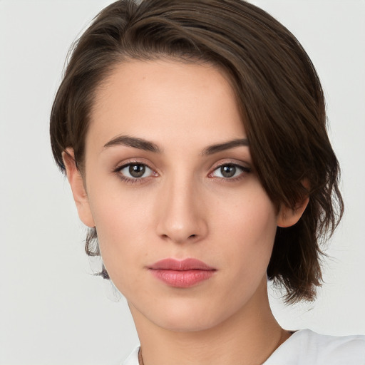 Neutral white young-adult female with medium  brown hair and brown eyes