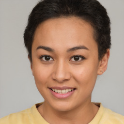 Joyful latino young-adult female with short  brown hair and brown eyes