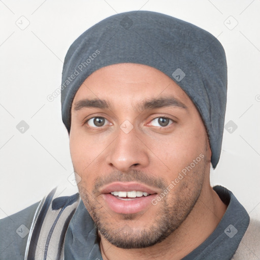 Joyful white young-adult male with short  black hair and brown eyes