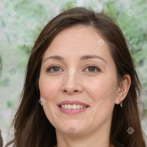 Joyful white adult female with long  brown hair and brown eyes