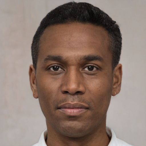 Neutral black young-adult male with short  black hair and brown eyes