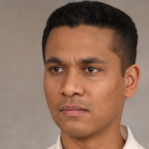 Neutral latino young-adult male with short  black hair and brown eyes