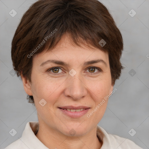 Joyful white adult female with short  brown hair and brown eyes