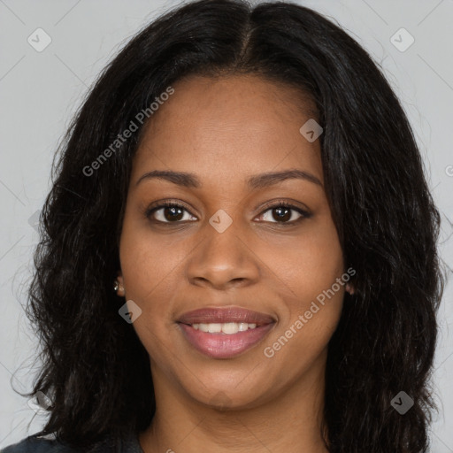 Joyful black young-adult female with long  black hair and brown eyes