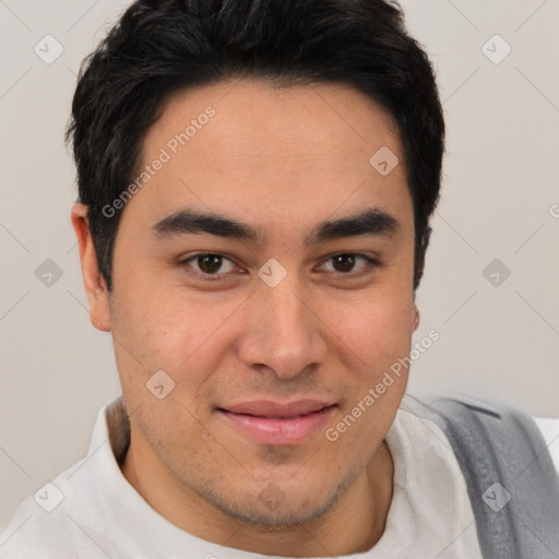 Joyful latino young-adult male with short  brown hair and brown eyes