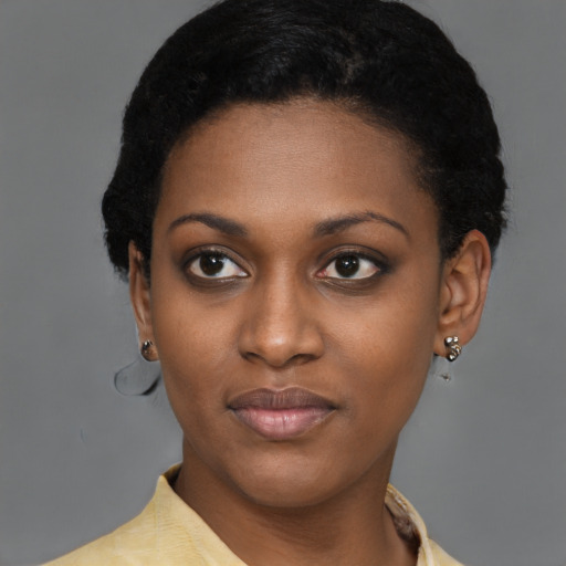 Joyful latino young-adult female with short  black hair and brown eyes