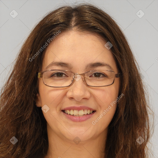 Joyful white adult female with long  brown hair and brown eyes