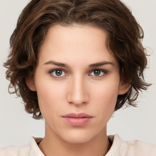 Neutral white young-adult female with medium  brown hair and brown eyes