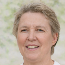 Joyful white middle-aged female with medium  brown hair and grey eyes