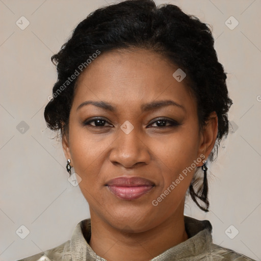 Joyful black adult female with medium  brown hair and brown eyes