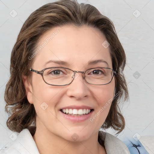 Joyful white adult female with medium  brown hair and blue eyes