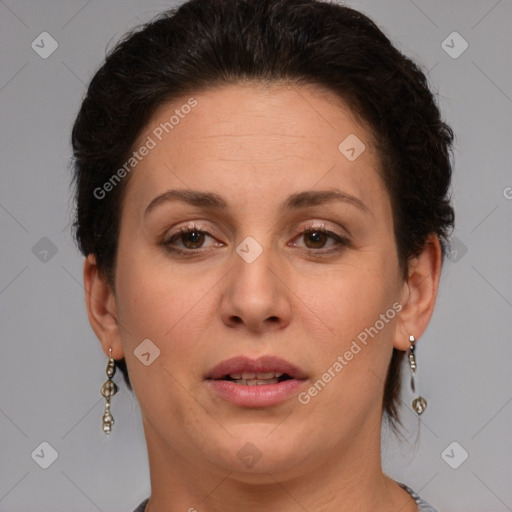 Joyful white adult female with short  brown hair and brown eyes