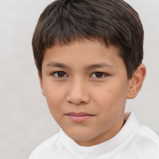 Joyful white child male with short  brown hair and brown eyes