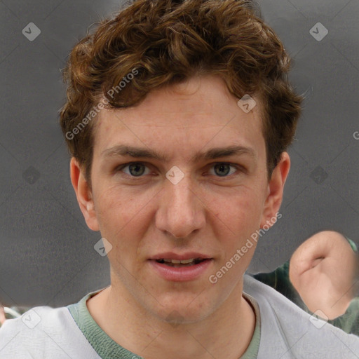 Joyful white adult male with short  brown hair and grey eyes